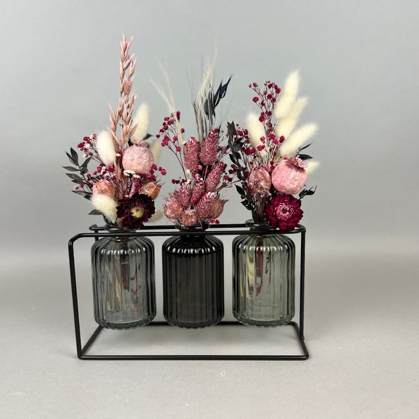 Vases of dried flowers in a metal stand table decoration boho dried flower bouquet metal frame