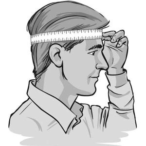 May include: A black and white line drawing showing a profile view of a head with a white measuring tape wrapped horizontally around the forehead and back of the skull to determine the circumference of the head for sizing purposes.