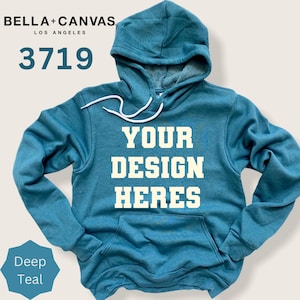 May include: A deep teal hooded sweatshirt featuring a front kangaroo pocket, long sleeves, and white drawstrings. The text "YOUR DESIGN HERES" is printed in large, cream-colored block letters across the chest of the garment.
