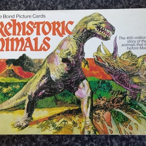 Brooke Bond-prentkaarten Prehistorische dieren. complete set in officieel album