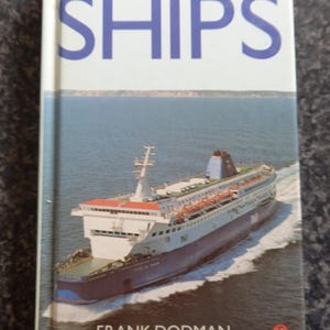 May include: A hardcover book titled Observers Ships by Frank Dodman. The cover features a photograph of a large white and blue ferry sailing on the ocean, leaving a white wake behind it. The title is printed in large blue letters at the top.