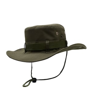 May include: A green canvas bucket hat with a wide brim and a brown adjustable strap. The hat has a chin strap and a small metal button on the top.