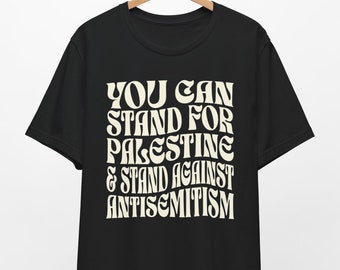 May include: Black t-shirt with a white graphic that reads "You can stand for Palestine & stand against antisemitism" in a retro font.