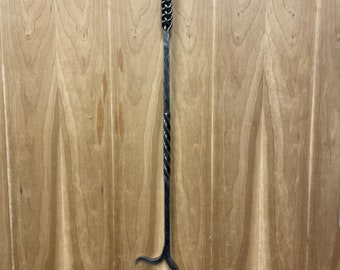 BLACKSMITH HAND FORGED fireplace poker. Length is 32 inches.