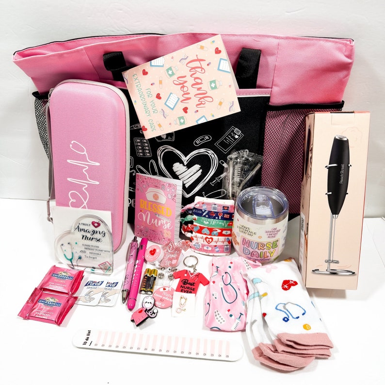 May include: A pink tote bag filled with various gifts for a nurse, including a pink tumbler with the text "Nurse Daily", a pink pen, a keychain with the text "Best Nurse Ever", a small pink notebook with the text "Blessed Nurse", and a pink and white striped tote bag with the text "For Your Extraordinary Care".