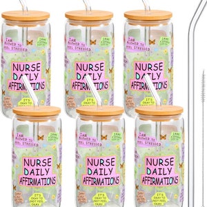 May include: Set of six glass tumblers with bamboo lids and matching straws. Each tumbler features a pink and green design with the text "Nurse Daily Affirmations" and various affirmations.