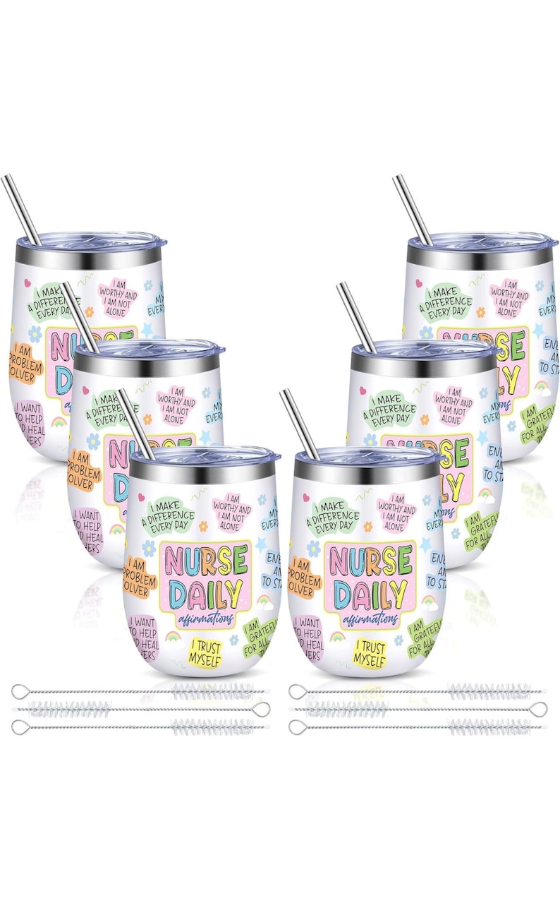 May include: Set of six white stainless steel wine tumblers with colorful motivational quotes for nurses. Each tumbler features the text "Nurse Daily" and positive affirmations. The set includes six matching straws and six cleaning brushes.