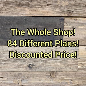 May include: A wooden background featuring the text "The Whole Shop! 84 Different Plans! Discounted Price!" in yellow. The background is composed of horizontal wooden planks in shades of brown and grey.