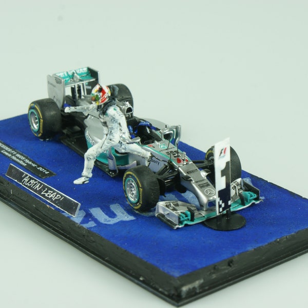 1:43 model of Lewis Hamilton leaping from his car after winning the 2015 United States Grand Prix