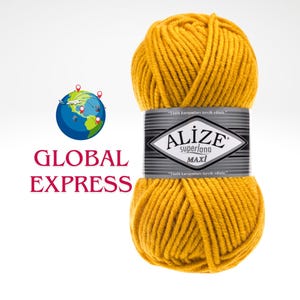 May include: A ball of mustard yellow Alize Superlana Maxi yarn. The yarn is wrapped with a black and silver label. The words "ALIZE Superlana MAXI" are printed on the label. The words "GLOBAL EXPRESS" are printed in red.