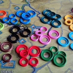 War of the Ring 2nd Edition colorful miniature base rings and border mountains