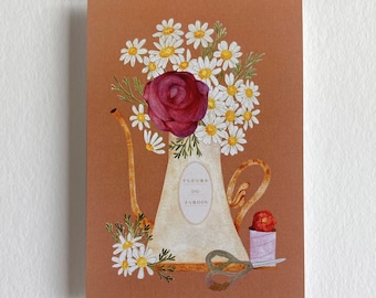 May include: A watercolor illustration of a vintage watering can filled with white daisies and a single red rose. The watering can has a label that reads "FLEURS DE JARDIN". There is a spool of thread and a pair of scissors next to the watering can.