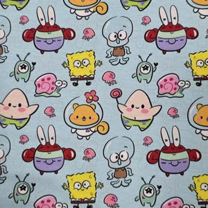 May include: Light blue fabric featuring a repeating pattern of cartoon characters, including SpongeBob SquarePants, Patrick Star, Squidward Tentacles, Mr. Krabs, Gary the Snail, and others. The design includes small pink jellyfish and other aquatic-themed elements.