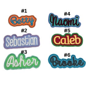 May include: Six colourful embroidered iron-on patches with names: Betty, Sebastian, Asher, Naomi, Caleb, and Brooke. Each patch has a number from 1 to 6.