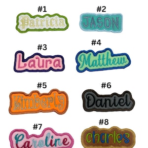 May include: Eight embroidered iron-on name patches in various colours and fonts. The names are Patricia, Jason, Laura, Matthew, Kimberly, Daniel, Caroline, and Charles.