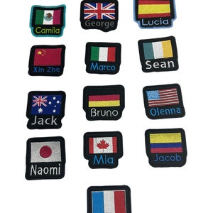 May include: Twelve embroidered patches featuring flags of various countries, each with a name written beneath. The names are: Camila, George, Lucia, Xin Zhe, Marco, Sean, Jack, Bruno, Olenna, Naomi, Mia, Jacob, and Gabriel.