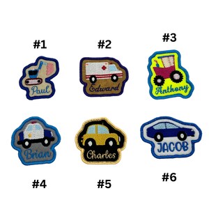 May include: Six embroidered iron-on patches with different vehicle designs and names. The patches are on a white background. The vehicles include a construction vehicle, an ambulance, a tractor, a police car, a yellow car, and a blue car. The names on the patches are Paul, Edward, Anthony, Brian, Charles, and Jacob.