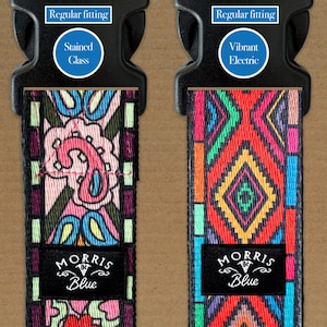 May include: Two dog collar straps with black buckles. One has a paisley design in pink, blue, and green, labelled "Stained Glass." The other has a geometric pattern in red, orange, and blue, labelled "Vibrant Electric." Both straps have "MORRIS Blue" labels.
