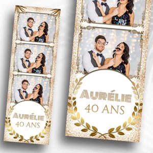 以下が含まれることがあります： 金色と白のフォトブースの背景に、金色の月桂樹の輪のデザインと「Aurélie 40 ans」の文字が書かれています。