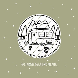 May include: A black and white illustration of a camper with mountains and trees, surrounded by the text "Camping is my favorite season." The design is on a green background with white dots.