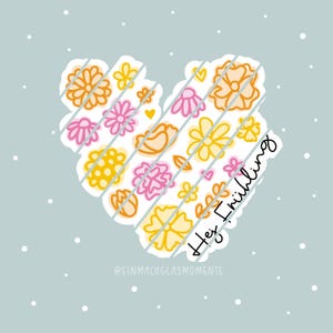 May include: A heart-shaped illustration filled with colorful flowers in shades of orange, pink, and yellow, set against a light blue background with white dots. The text "Hey Frühling" is written in black cursive.