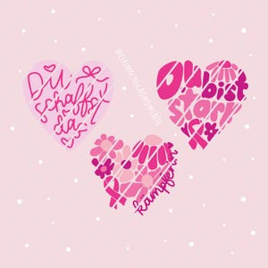 May include: Three heart-shaped graphics on a light pink background with white dots. The left heart is light pink with the text Du schaffst das. The right heart is dark pink with the text Du bist stark. The bottom heart features pink flowers.