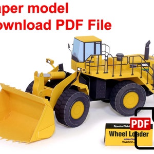 Könnte beinhalten: Ein gelbes Papiermodell eines Komatsu WA600 Radladers. Das Modell ist vollständig zusammengebaut und bereit zur Präsentation. Das Modell ist ein spezielles Fahrzeug-Papiermodell zum Herunterladen als PDF-Datei.