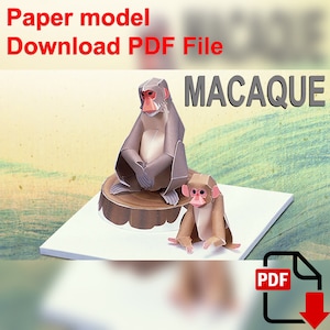 May include: Paper model download PDF file of a macaque monkey sitting on a tree stump. The monkey is brown and gray with a pink face. The PDF file icon is in the lower right corner of the image.