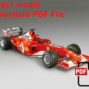 Könnte beinhalten: Ein rotes und weißes Formel-1-Rennwagen mit den Worten "Marlboro" und "Vodafone" an der Seite. Ein PDF-Download-Symbol befindet sich in der unteren rechten Ecke des Bildes. Der Text "Paper model Download PDF File" befindet sich oben im Bild.