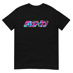 May include: Black t-shirt with the word "BOHO" in a colorful, tropical-themed design. The text features a combination of pink, blue, and yellow, with a palm tree pattern. The shirt is made of a soft material.