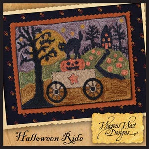 May include: A Halloween-themed needlepoint design featuring a wagon carrying a jack-o'-lantern, a black cat, and a star. The wagon is traveling through a spooky landscape with a house, trees, and a full moon. The design is framed in a brown and orange border.