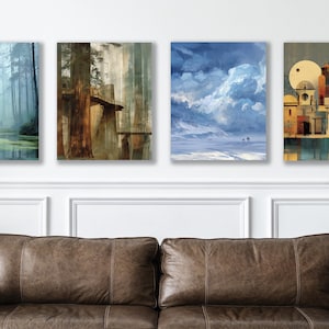 May include: Four framed landscape art prints. The prints depict a misty forest, a redwood forest, a snowy landscape with clouds, and a cityscape with a large moon. The art is displayed above a brown leather sofa.