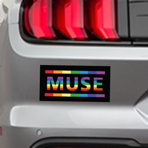 May include: A black and white car bumper sticker with a rainbow stripe design and the word "MUSE" in white letters.