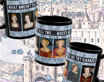 May include: Black ceramic mugs with historical portraits and the text "WHAT DOESN'T KILL YOU... MAKES ME TRY HARDER." The mugs feature images of historical figures in ornate frames, set against a backdrop of a castle illustration.