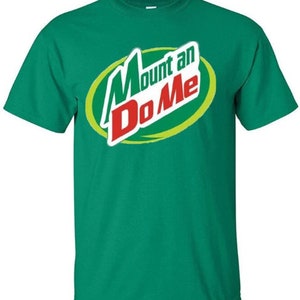May include: A green t-shirt with a parody logo of a popular drink brand. The logo says "Mount an Do Me" in a green and red font.