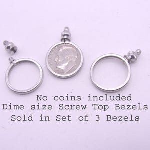 May include: Silver-colored dime-size screw-top bezels. One bezel holds a dime coin. The image shows three bezels, one with a coin, one without, and a detached screw top. The text says "No coins included".