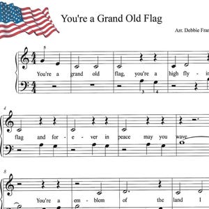 May include: Sheet music for "You're a Grand Old Flag" with an illustration of the American flag in the upper left corner. The music includes lyrics and musical notation, with the arranger's name, Debbie Frandsen, at the top.