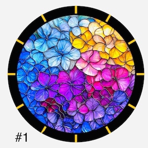 May include: A round clock with a black frame and gold accents. The clock face features a colourful floral design with blue, purple, pink, and yellow flowers.