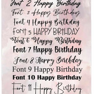 May include: A display of twelve different fonts, each showcasing the phrase "Happy Birthday." The text is in black, set against a soft, watercolor-style pink and white background. The fonts vary in style, from elegant scripts to bold sans-serifs.