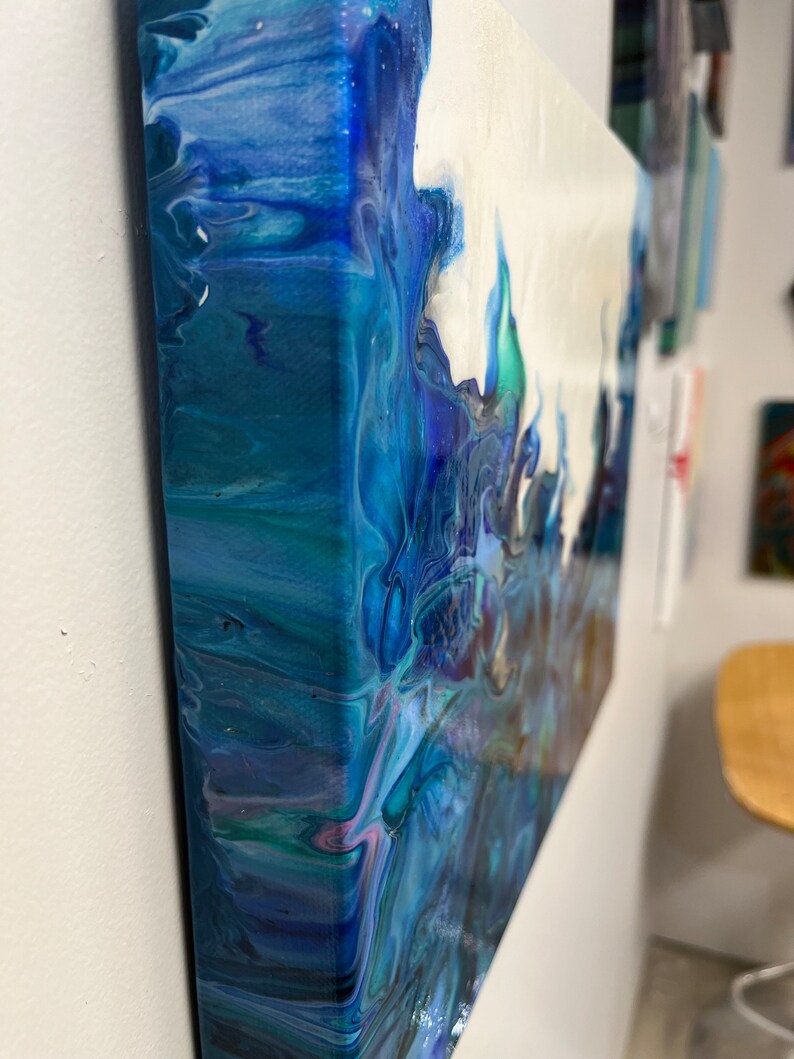May include: Abstract painting on canvas with blue, white, and green colors. The paint is swirled and layered, creating a dynamic and textured effect.