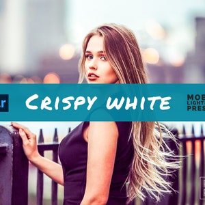 May include: A woman with long blonde hair, wearing a black dress, leans against a metal railing. The image has a teal banner with the words "Crispy White" and "Mobile Lightroom Presets". The Preset Plus+ logo is in the bottom right corner.
