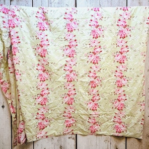 May include: A white ceramic mug with a black handle and the text "But First, Coffee" in a bold, black font. The mug sits on a white surface, showcasing its clean design.