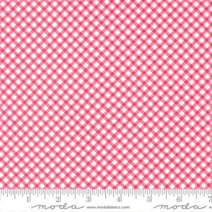 May include: Pink and white gingham fabric with a small checkered pattern. The fabric is shown with a ruler for scale.