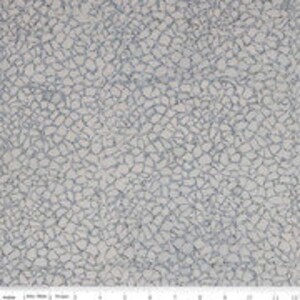 May include: White fabric with a subtle, textured pattern resembling a cracked surface. The pattern is made up of small, irregular shapes and lines in a light gray color.