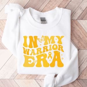 In My Warrior Era Youth Sarcoma Awareness Crewneck Sweatshirt, Youth Sarcoma Warrior Sweatshirt, Sarcoma Awareness Gifts, Sarcoma Fighter