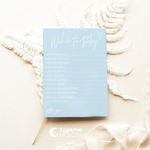 May include: A light blue card with the text "Wishes for Baby" in white script. The card has a list of wishes for a baby, such as "I hope you become", "I hope you learn to", "I hope you experience", "I hope you love", "I hope you get to", "I hope you know", "I hope you always", "I hope you never", "I hope you get your mother's", "I hope you get your father's", "I hope you never forget", and "And I hope that you". The card is signed "With Love" and has a small heart symbol in the top right corner.