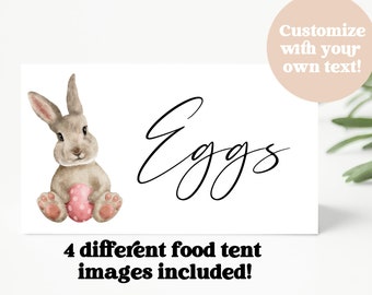May include: A printable food tent card with a watercolor illustration of a brown bunny holding a pink egg. The text "Eggs" is written in cursive script. The text "4 different food tent images included!" is also included on the card.
