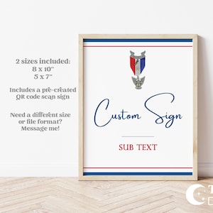 May include: Framed custom sign with a white background, blue and red accents, and a decorative emblem. The sign includes the text "Custom Sign" in a script font, with space for subtext. The frame is a light wood color.
