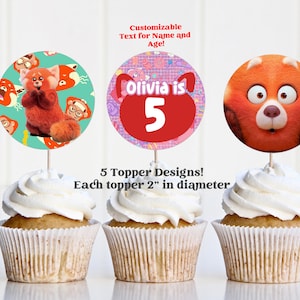 May include: Five cupcake toppers featuring a red panda character from the animated series "Red Panda" with the text "Olivia is 5". Each topper is 2 inches in diameter.