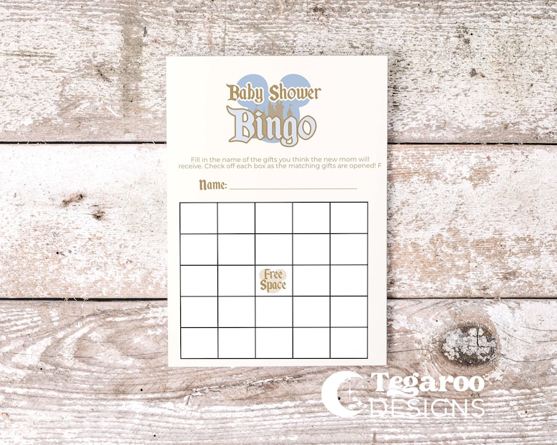 May include: A cream-colored Baby Shower Bingo card with blue and gold text and graphics. The card has a grid for game play and includes the text "Free Space". The Tegaroo Designs logo is at the bottom.